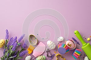 Top view photo of kitchen utensils bunch of lavender flowers colorful easter eggs in paper baking molds and sprinkles