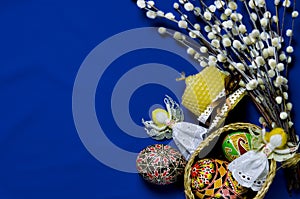 Easter Pussy-willow and Easter egg on blue background. Happy Easter card. with Happy Easter