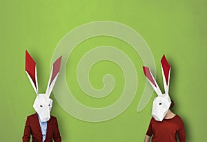 Easter rabbits on green background