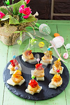 Easter recipe, festive appetizer. Canapes with pineapple, grill chicken, marinated peppers - on the festive table