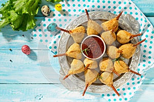 Easter recipe, festive appetizer. Meat in biscuits, deep fried served with ketchup sauce