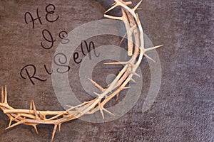 Easter He is Risen Quote surrounded by a Crown of Thorns on a te