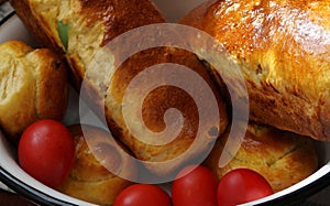 Easter Romanian bread. Traditional sweet bread and red eggs for Easter. Sponge cake cozonac out of the oven