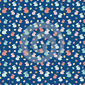 Easter seamless pattern with little eggs and rabbits isolated on dark blue background. Cute vector