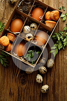 Easter set in a box of eggs, cupcakes and festive decorations