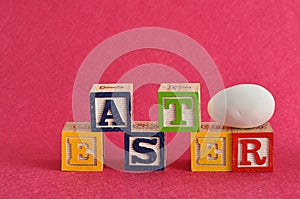 Easter spelled with alphabet blocks and a easter egg