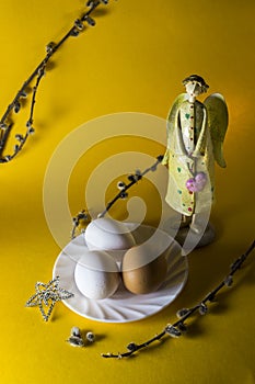 Easter still life from angel, eggs and willow