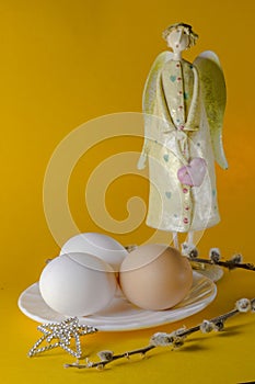 Easter still life from angel, eggs and willow