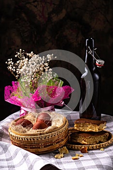 Easter still life. Eggs in a wicker basket. Christian holiday and food