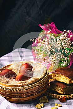 Easter still life. Eggs in a wicker basket. Christian holiday and food