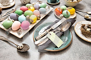Easter still life table place decoration colored eggs