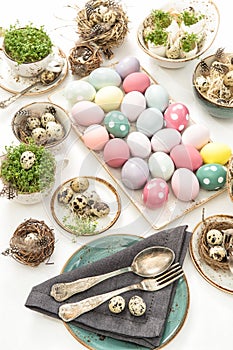 Easter still life. table place setting decoration colored eggs