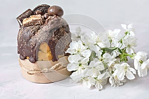 Easter still life. Traditional pastries, painted eggs and white cherry flowers