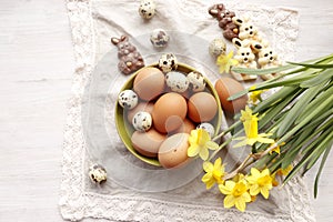 Easter still life. Yellow daffodils and eggs.