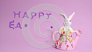 Easter stop motion animation. Beautiful Easter bunny is moving in the frame, a plasticine inscription Happy Easter