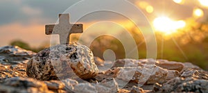 Easter symbolism empty tomb and cross on meadow at sunrise, good friday concept