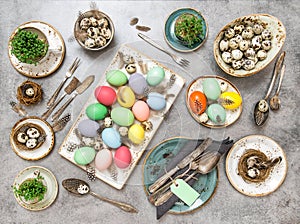 Easter table decorations colored eggs Flat lay