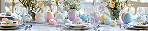 Easter table setting adorned with pastel-colored linens, fresh flowers,