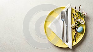 Easter Table Setting with Eggs and Blossoms.