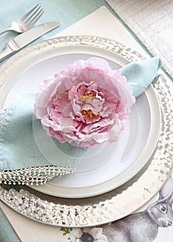 Easter Table setting with flower napkin ring in pink and bright green