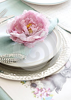 Easter Table setting with flower napkin ring in pink and bright green