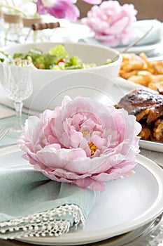 Easter Table setting with flower napkin ring in pink and bright green