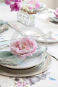 Easter Table setting with flower napkin ring in pink and bright green