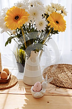 Easter table setting with flowers and eggs