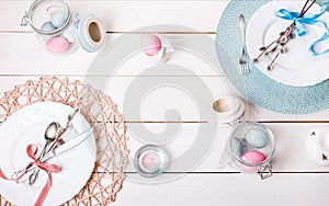 Easter table setting with gold and blue eggs and cutlery. Holidays background.