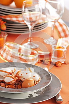 Easter table setting in orange tones