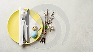 Easter Table Setting with Eggs and Blossoms.