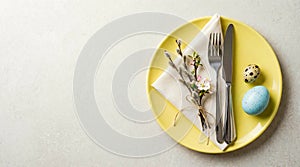 Easter Table Setting with Eggs and Blossoms.