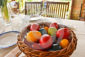 Easter tablewear outdoor under the pergola with colorful eggs in a sunny day photo