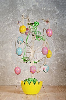 Easter tree on abstract grey background.