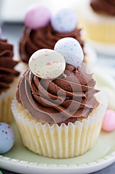 Easter vanilla cupcakes with chocolate frosting