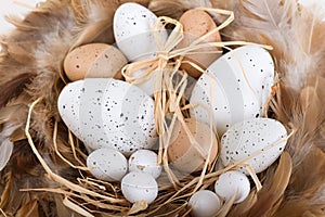 Easter eggs and basket and feathers