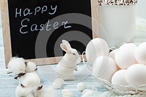 Easter white eggs and rabbit. Place for text