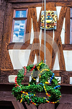 Easter wreath and coat of arms at the town hall in Michelstadt, Odenwald