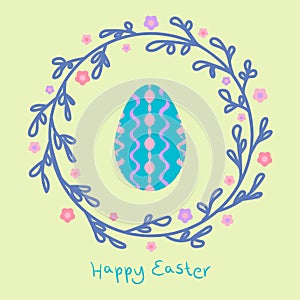 Easter wreath with colorful egg and leaves on pastel background
