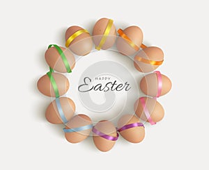 Easter wreath of eggs with colorful ribbons.