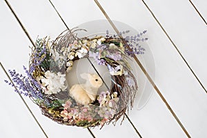 Easter wreath with rabbit. Wooden floor. Background. Easter