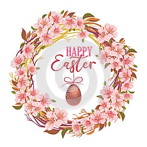 Easter wreath of sakura branches with easter egg