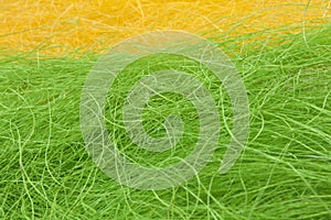 Easter yellow and green straw background