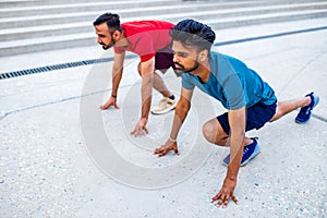 eastern ethnic people exercising together outdoor on sun light