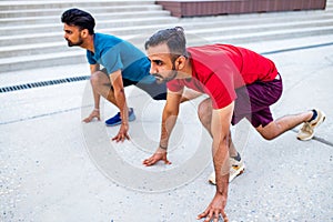 eastern ethnic people exercising together outdoor on sun light