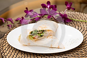 Eastern roll pita with vegetables, meat. Eastern quisine photo