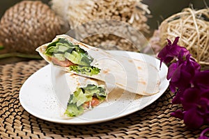 Eastern roll pita with vegetables, meat. Eastern quisine photo