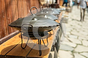 Eastern Saj pots for barbacue or kebap for sale at the market.