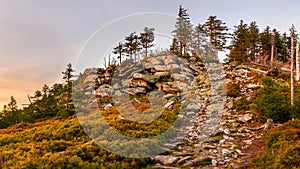 Eastern Sudetes, mountain landscape, rocky trail on the hiking trail leading to the top of Czarna Gora. The trail is lit