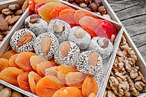 Eastern sweets dried fruits and nuts in a wooden box. Background. Healthy vegan food. Natural food